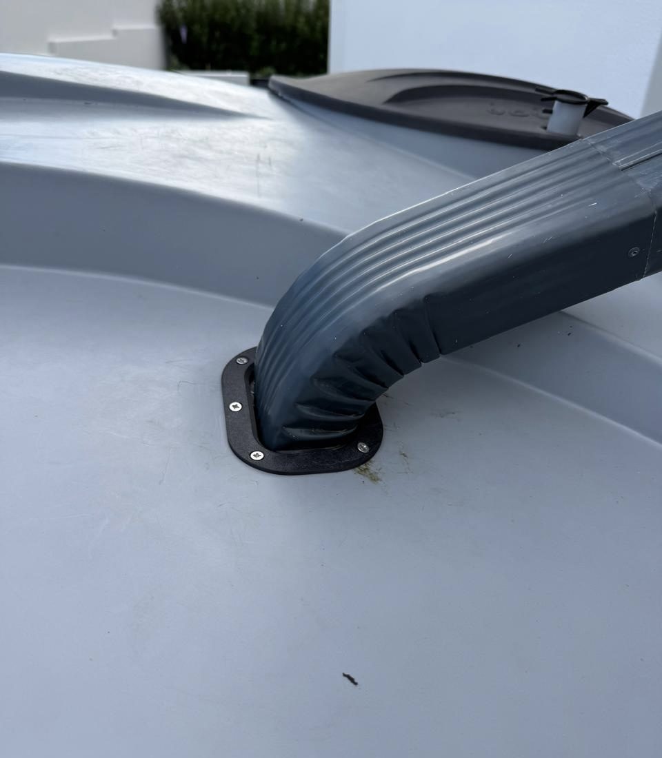 Pro Clean-Fit Inlet installed on a water tank with the downpipe connected