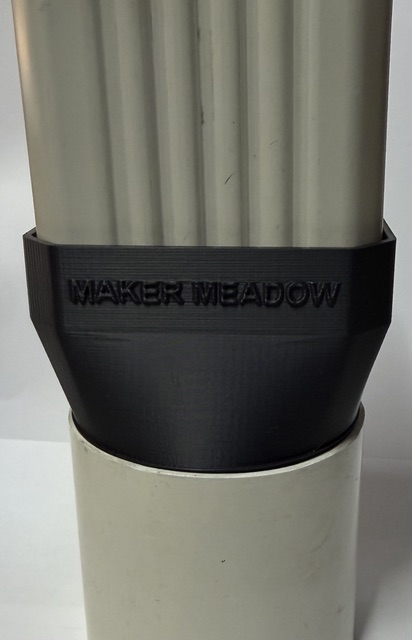 Downpipe adapter connecting a domestic aluminium downpipe to an 80 mm round PVC downpipe